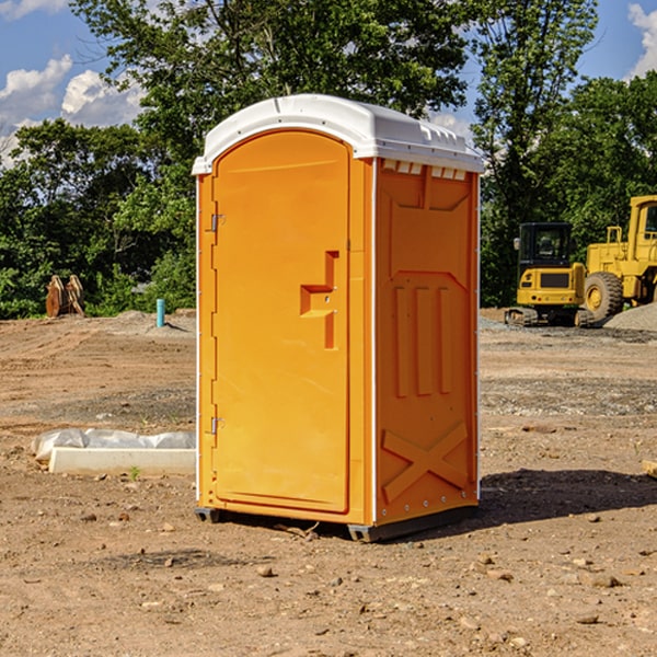 what is the cost difference between standard and deluxe portable restroom rentals in Bond County